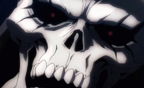 A Close Up Of A Skeleton 'S Face With Red Eyes GIF