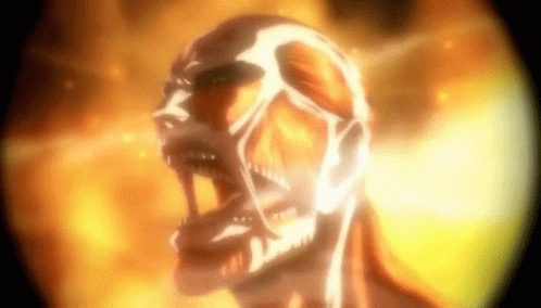 A Close Up Of A Skeleton With Its Mouth Open And Fire Behind It . GIF