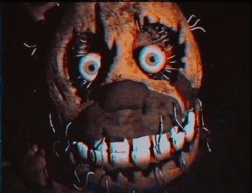 A Close Up Of A Skeleton With Sharp Teeth Looking At The Camera GIF