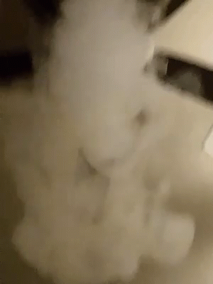 A Close Up Of A Smoke Coming Out Of A Pipe GIF