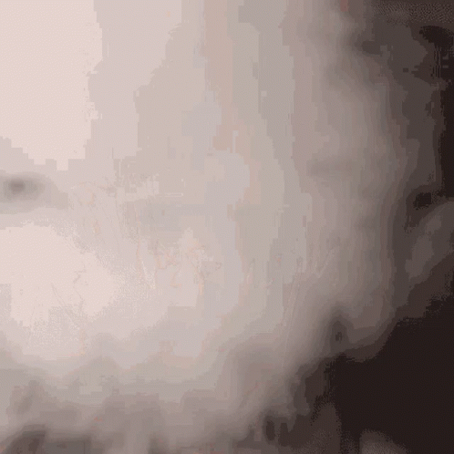 A Close Up Of A Smoke Coming Out Of A Window GIF