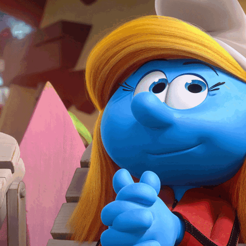 A Close Up Of A Smurf With A Yellow Hat On GIF