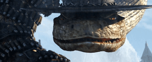 A Close Up Of A Snake 'S Mouth With A Sword In It 'S Mouth GIF