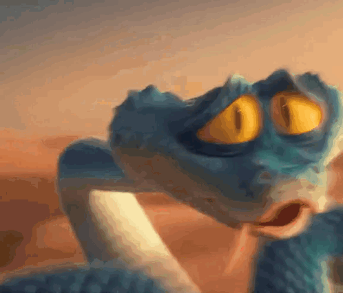 A Close Up Of A Snake With Yellow Eyes GIF