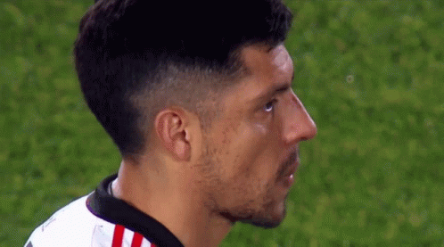 A Close Up Of A Soccer Player 'S Face On A Field GIF