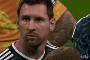 A Close Up Of A Soccer Player 'S Face On A Green Field GIF