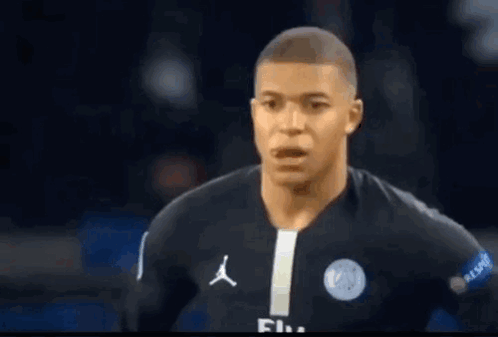 A Close Up Of A Soccer Player Wearing A Black Jersey With A White Stripe . GIF