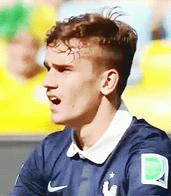 A Close Up Of A Soccer Player Wearing A Blue Jersey With The Letter D On It GIF