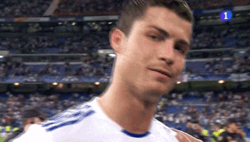 a close up of a soccer player wearing a white shirt with blue stripes .