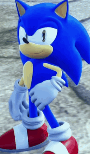 A Close Up Of A Sonic The Hedgehog Standing On The Ground GIF