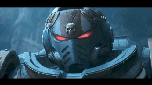 A Close Up Of A Space Marine 'S Helmet With Red Eyes And A Skull On It GIF