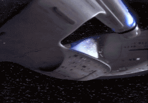 A Close Up Of A Space Ship With A Blue Light Coming Out Of The Bottom GIF