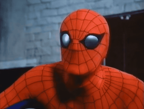 a close up of a spider man 's face and eyes