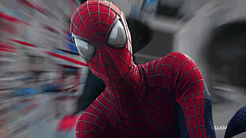 a close up of a spider man 's face with a blurred background and the word uan on the bottom