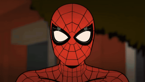 A Close Up Of A Spider Man 'S Face With A Brick Wall In The Background GIF