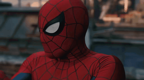 A Close Up Of A Spider Man 'S Face With His Eyes Closed GIF