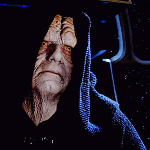 A Close Up Of A Star Wars Character With A Hood GIF