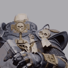 A Close Up Of A Statue Of A Knight With A Skull On His Chest And Shoulder . GIF