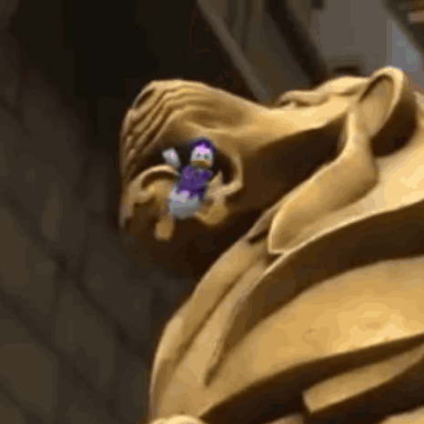 A Close Up Of A Statue Of A Man With A Purple Object In His Mouth GIF