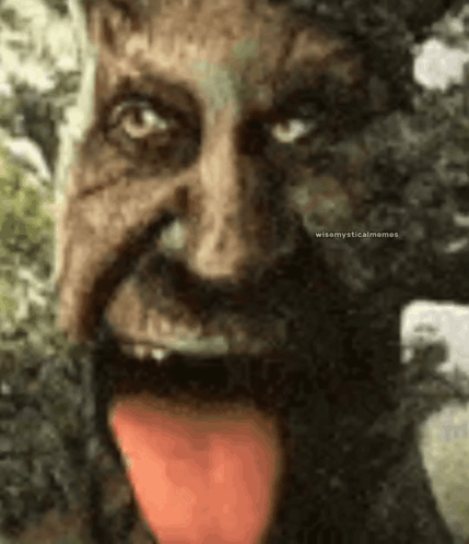 A Close Up Of A Statue Of A Man With His Tongue Out . GIF