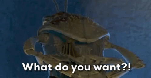 A Close Up Of A Statue With The Words What Do You Want Written On It GIF