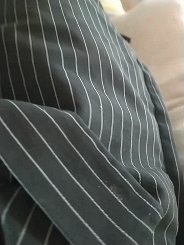 A Close Up Of A Striped Shirt With White Stripes On It GIF