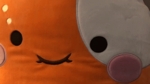 A Close Up Of A Stuffed Animal 'S Face GIF