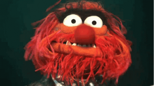 A Close Up Of A Stuffed Animal With A Big Mouth GIF