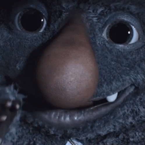 A Close Up Of A Stuffed Animal With A Big Nose GIF