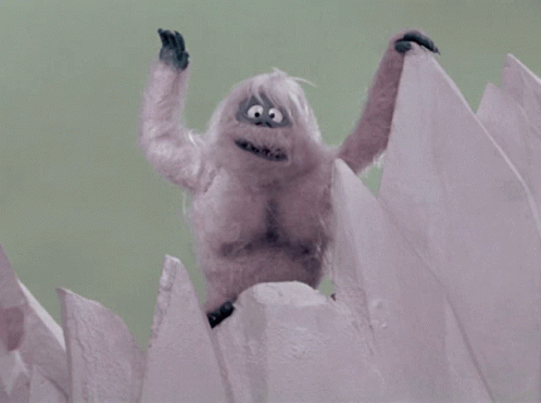 A Close Up Of A Stuffed Animal With A Big Smile On Its Face GIF