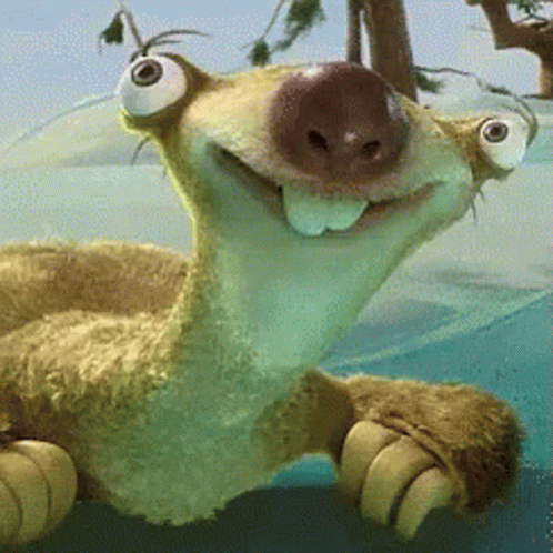 A Close Up Of A Stuffed Animal With Big Eyes And A Smile On Its Face GIF