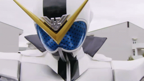 A Close Up Of A Superhero 'S Face With A Blue And Gold Emblem On It GIF
