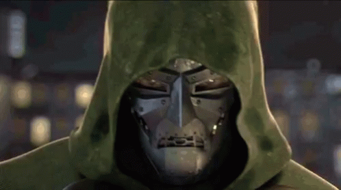 A Close Up Of A Superhero Wearing A Green Hood And A Mask . GIF