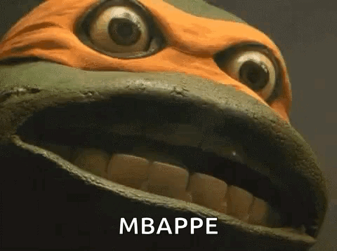 A Close Up Of A Teenage Mutant Ninja Turtle 'S Face With Its Mouth Open And The Words Mbappe Written On It . GIF