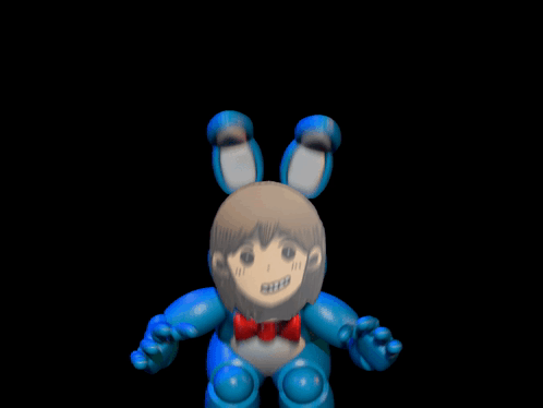 A Close Up Of A Toy With A Drawing Of A Girl 'S Face On It GIF