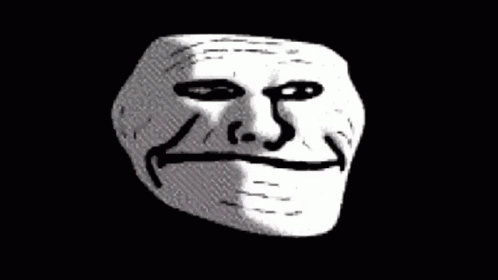 A Close Up Of A Troll Face On A Black Background GIF
