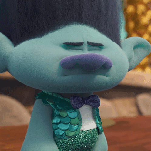 A Close Up Of A Troll With A Bow Tie GIF