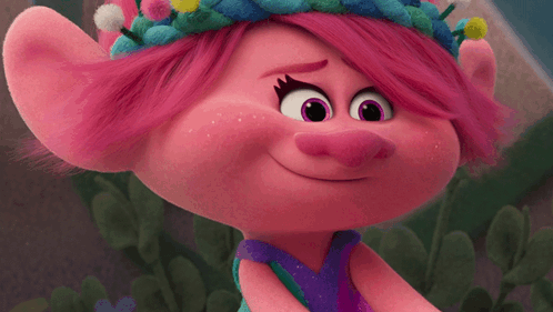 A Close Up Of A Troll With Pink Hair And Purple Eyes GIF