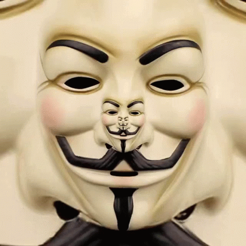 A Close Up Of A V For Vendetta Mask With A Mustache And Eyebrows GIF