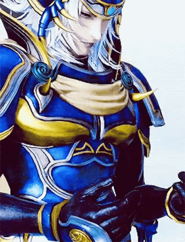 A Close Up Of A Video Game Character Wearing A Blue And Gold Armor And Gloves . GIF