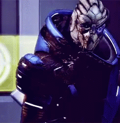 A Close Up Of A Video Game Character With A Blue Helmet GIF