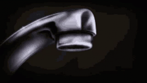 A Close Up Of A Water Faucet With Water Dripping From It . GIF