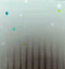 A Close Up Of A White Surface With A Blue And Green Circle On It GIF