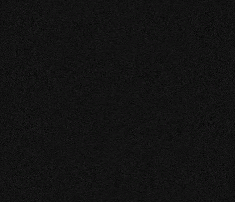 A Close Up Of A White Symbol On A Black Surface . GIF