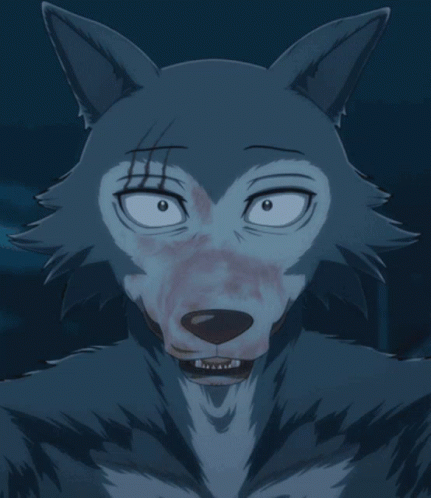 A Close Up Of A Wolf 'S Face With Blood On It 'S Face GIF
