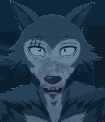 A Close Up Of A Wolf 'S Face With Its Tongue Out GIF