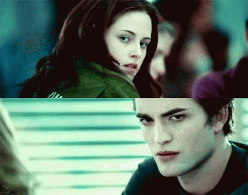 A Close Up Of A Woman And A Close Up Of A Man Looking At Each Other GIF