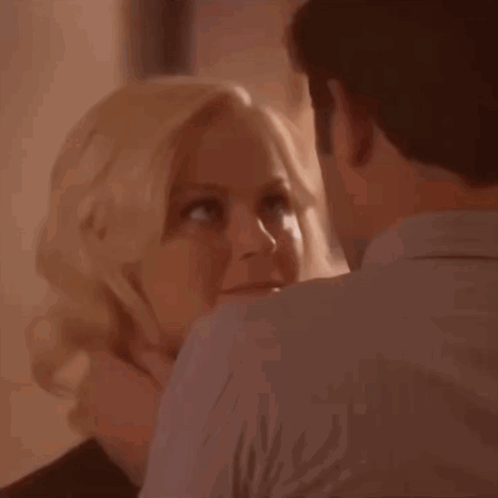A Close Up Of A Woman And A Man With The Words Uh Oh On The Bottom GIF