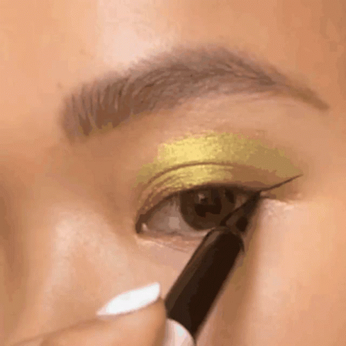 A Close Up Of A Woman Applying Eye Shadow GIF