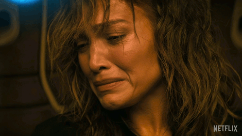Close Up Of Woman Crying With Netflix Logo GIF